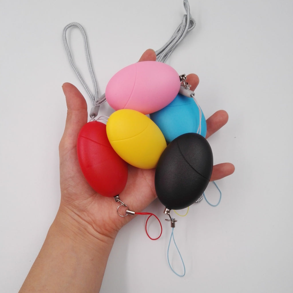 جهاز إنذار بيضاوي الشكل للدفاع عن النفس للنساء، وجهاز إنذار مضاد للتتبع للنساء