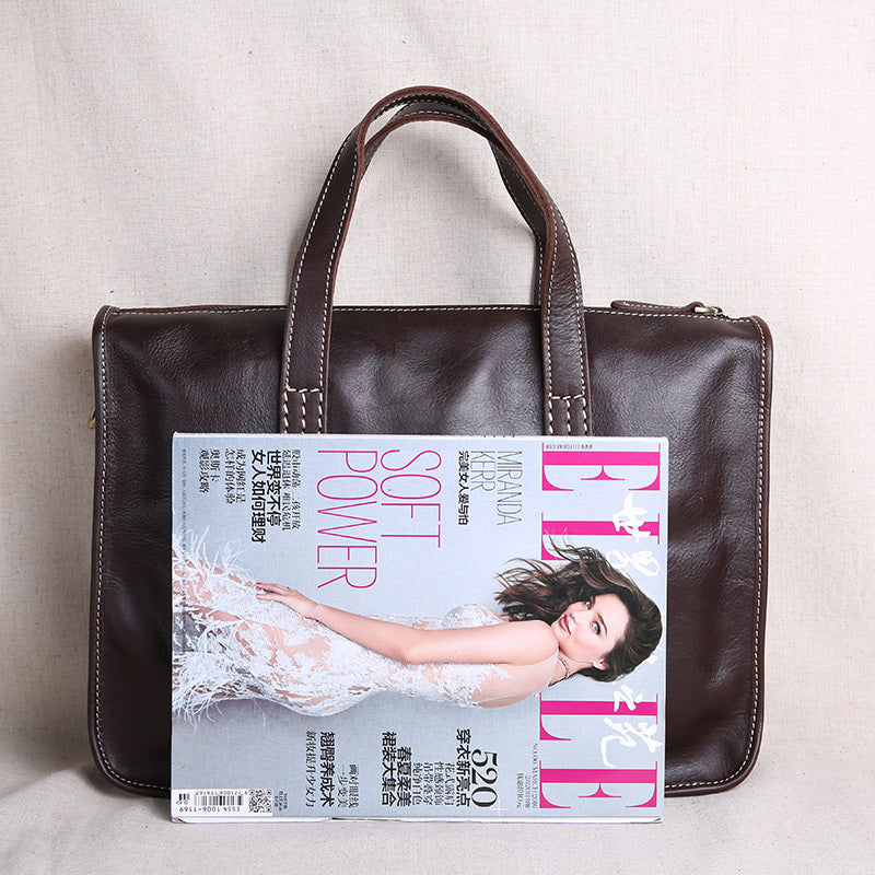 حقيبة جلدية أنيقة بتصميم أفقي، مناسبة للأعمال والاستخدام اليومي، مع حقيبة كمبيوتر.